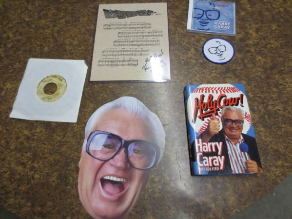 Assorted Harry Caray items including Jersey, song cards, mask, book, cd, record