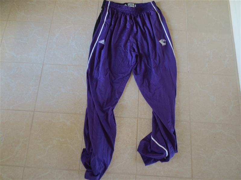 BASKETBALL Assortment of: Game Used Northwestern Wildcats Long Warm up pants, Celtics replica jersey, Globetrotters program