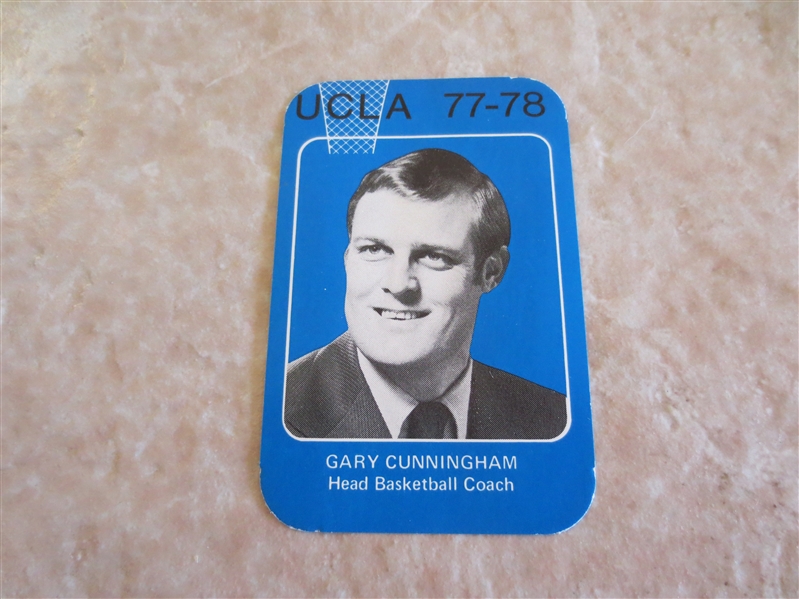 1977-78 UCLA basketball pocket schedule with coach Gary Cunningham pictured