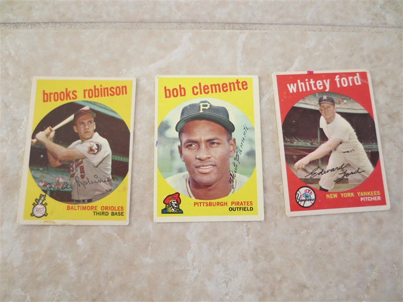 (3) 1963 Topps Baseball Hall of Famer baseball cards:  Clemente, Brooks Robinson, Ford
