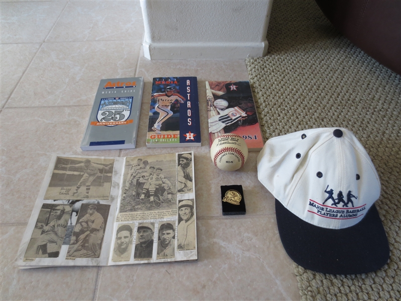 Houston Astros package of press pin, media guides, and includes old scrapbook, ball and cap
