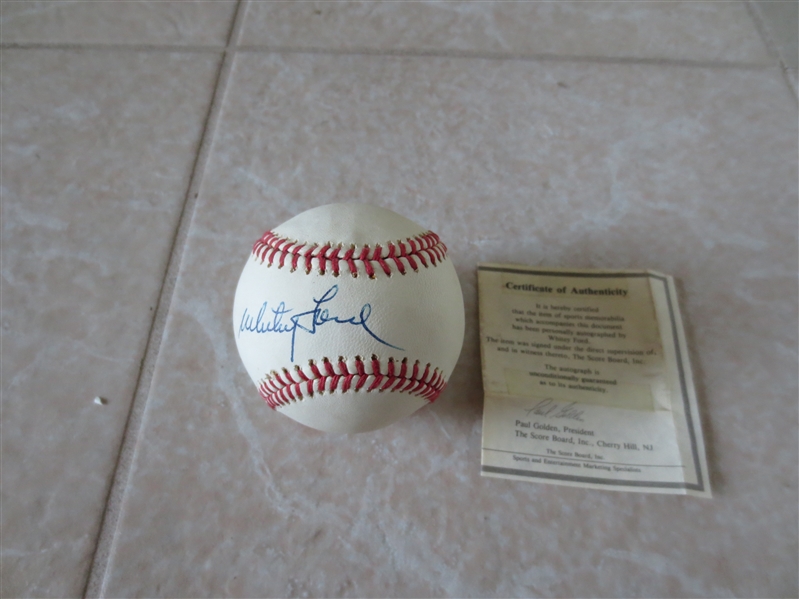 Autographed Yogi Berra and Whitey Ford single signed sweet spot baseballs