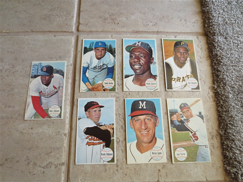 (7) different 1964 Topps Giants baseball cards of Hall of Famers: Clemente, Aaron, Koufax, Gibson, Robinson, Spahn, Torre