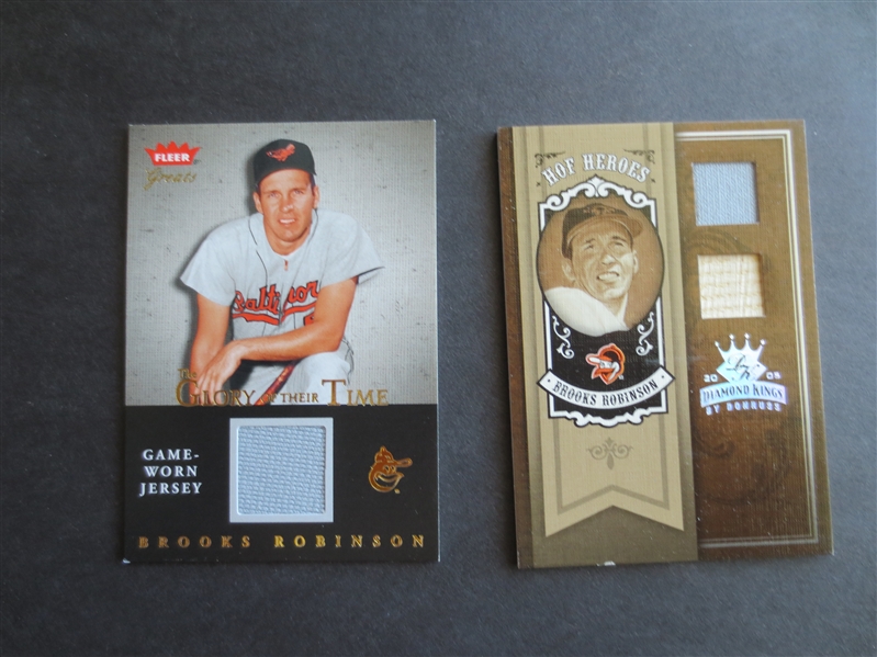 Two different Brooks Robinson Game Worn Jersey Baseball Cards