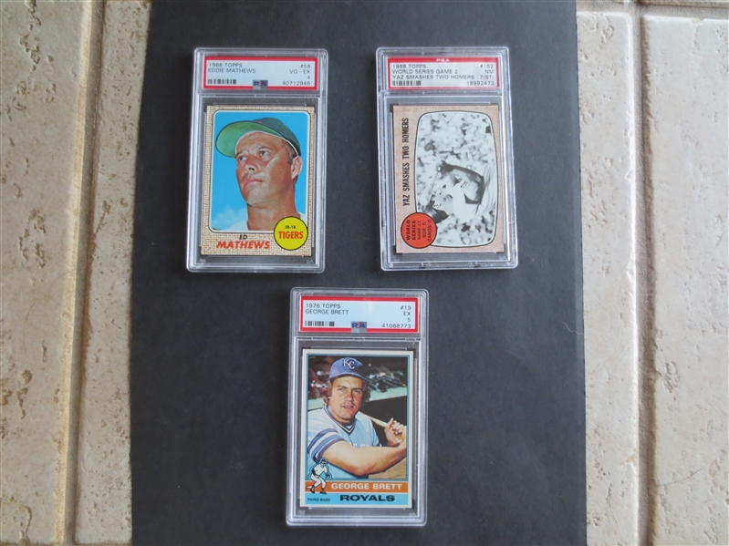 (3) different PSA Graded Baseball Cards of Hall of Famers:  Eddie Mathews, Yaz World Series, and George Brett